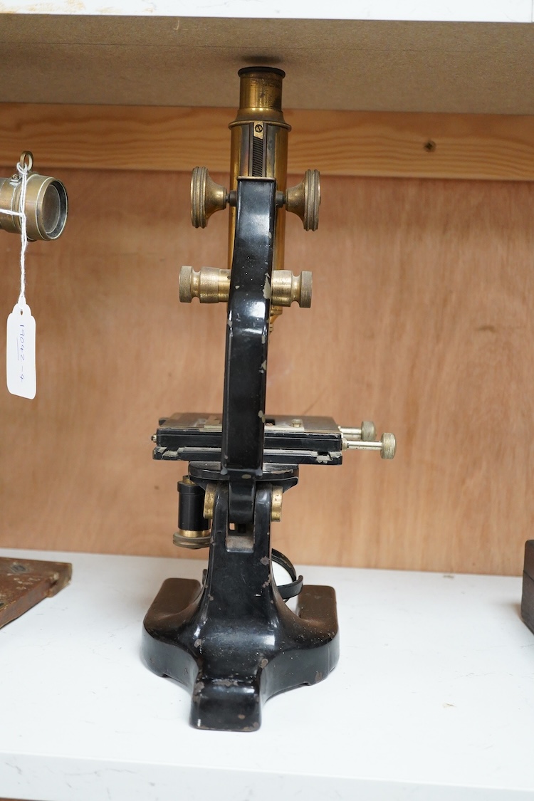 A late 19th century brass and cast iron microscope by Hearson, London, with engraved serial number; 278, approximate height 34cm